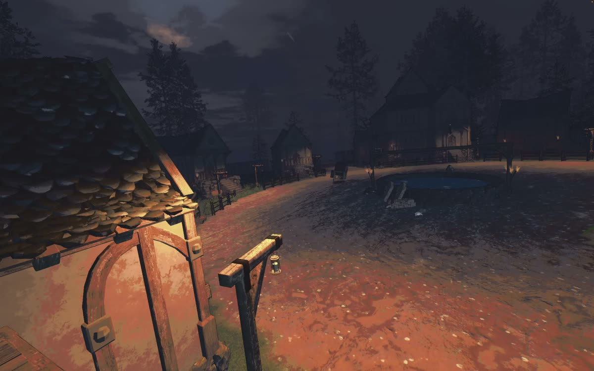 The cart crossing a village beneath the moon.